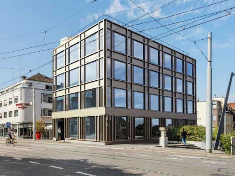 Modern office building with glass facade in an urban environment.