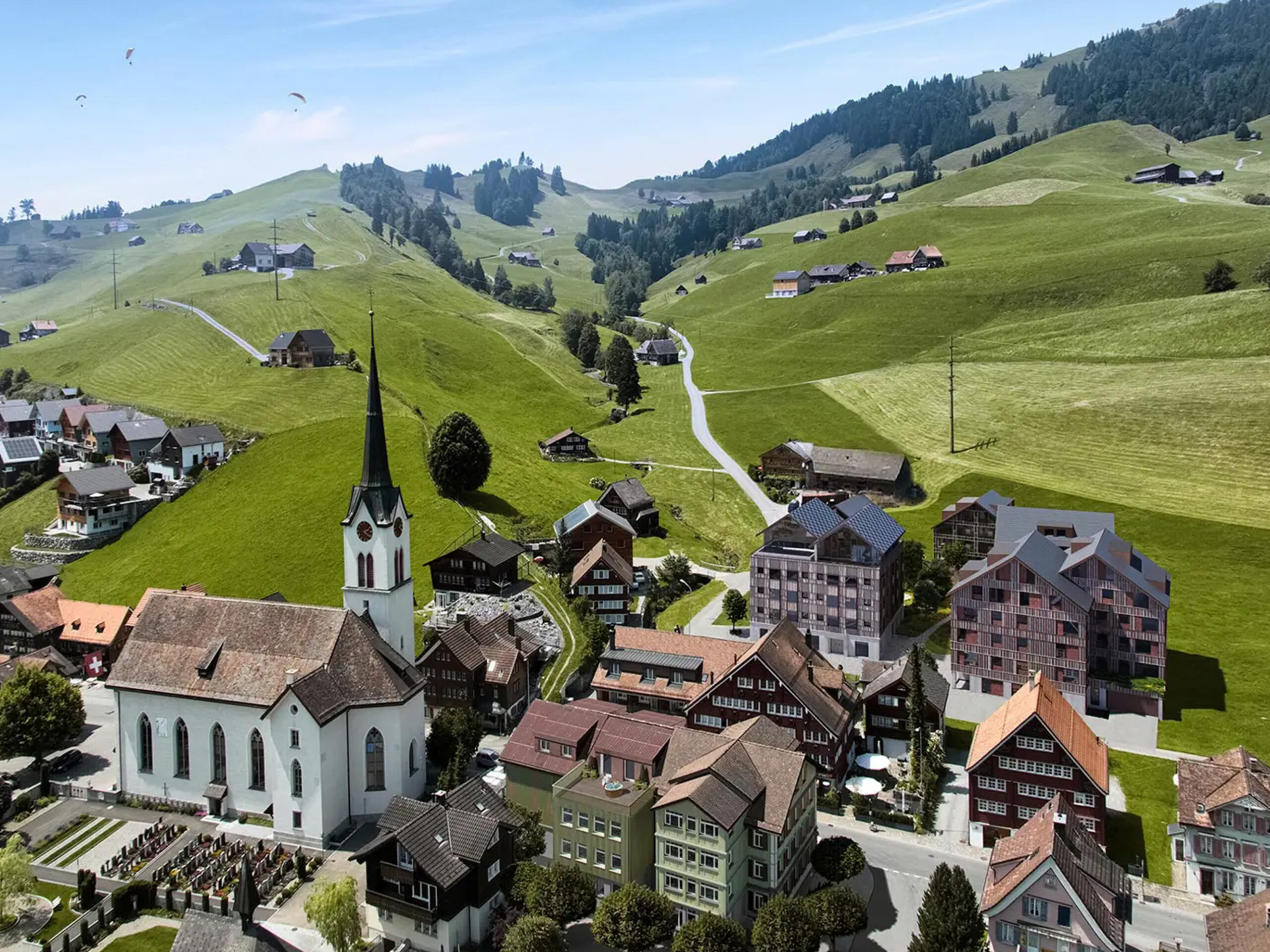 Swiss village with traditional buildings surrounded by green hills and a church in the center.